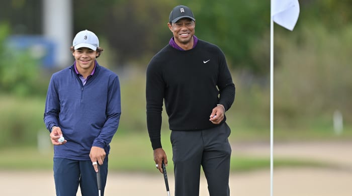 Tiger Woods and his son, Charlie Woods play the 15th green together prior to PNC Championship at Ritz-Carlton Golf Club on December 15, 2023 in Orlando, Florida.